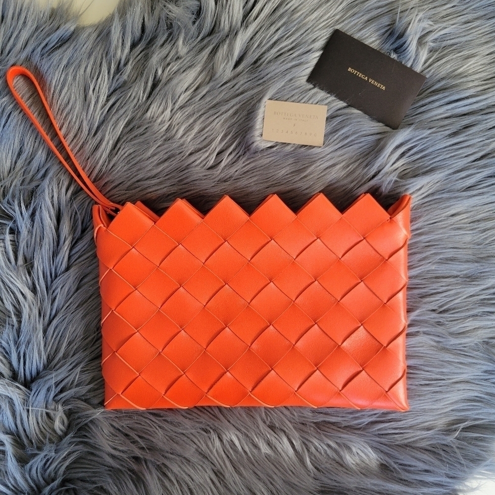 Bottega Veneta orange leather woven clutch